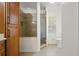 Bathroom featuring a glass shower and a window that provides natural light and ventilation at 5160 Wood Ridge Ct, Ocoee, FL 34761