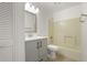 Bathroom with tub and shower combination, gray vanity, and neutral finishes at 5160 Wood Ridge Ct, Ocoee, FL 34761