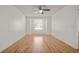 Bedroom with wood flooring, large window, and neutral walls at 5160 Wood Ridge Ct, Ocoee, FL 34761