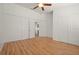 Bedroom with ceiling fan, closet, and laminate flooring at 5160 Wood Ridge Ct, Ocoee, FL 34761