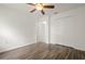 Bedroom featuring laminate flooring, closet, and a ceiling fan at 5160 Wood Ridge Ct, Ocoee, FL 34761
