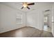 Bedroom featuring laminate flooring, ceiling fan, and closet at 5160 Wood Ridge Ct, Ocoee, FL 34761