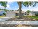 Charming single-story home features a well-maintained front yard and attached two-car garage at 5160 Wood Ridge Ct, Ocoee, FL 34761