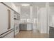 This kitchen features grey cabinetry, stainless appliances, and tile flooring at 5160 Wood Ridge Ct, Ocoee, FL 34761