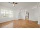 Spacious living room with wood floors, bright windows, and an inviting front entrance at 5160 Wood Ridge Ct, Ocoee, FL 34761