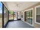 Screened patio features a ceiling fan and sliding doors for relaxing outdoor living at 5160 Wood Ridge Ct, Ocoee, FL 34761