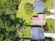 This bird's eye view shows properties with spacious lawns and verdant trees, creating a private and picturesque residential environment at 5216 Sunrise Blvd, Orlando, FL 32803