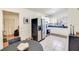 Eat in kitchen with stainless steel appliances and view to living room at 5216 Sunrise Blvd, Orlando, FL 32803