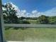 View of a large, well-maintained backyard with lush greenery and a privacy fence at 5350 Pine Lilly Dr, St Cloud, FL 34771