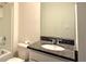 Bathroom featuring a granite countertop and a shower-tub combo at 5350 Pine Lilly Dr, St Cloud, FL 34771