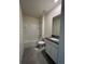 Well-lit bathroom featuring a shower-tub combo, vanity with granite countertop and ceramic tile flooring at 5350 Pine Lilly Dr, St Cloud, FL 34771