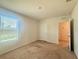 Bedroom featuring carpet and natural light from the window at 5350 Pine Lilly Dr, St Cloud, FL 34771
