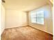 Neutral bedroom with a large window bringing in lots of natural light at 5350 Pine Lilly Dr, St Cloud, FL 34771