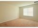 Cozy bedroom featuring neutral carpeting and a bright window for natural light at 5350 Pine Lilly Dr, St Cloud, FL 34771