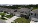 Two-story home shows large driveway, well-manicured lawn and covered porch at 5350 Pine Lilly Dr, St Cloud, FL 34771