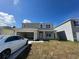 Charming two-story home featuring an attached garage and a well-manicured front yard at 5350 Pine Lilly Dr, St Cloud, FL 34771