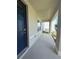 Side view of a covered front porch with a dark blue front door at 5350 Pine Lilly Dr, St Cloud, FL 34771