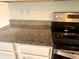 Close up of kitchen appliances with granite counters at 5350 Pine Lilly Dr, St Cloud, FL 34771