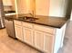 Granite countertop island featuring a stainless steel sink and dishwasher, perfect for cooking at 5350 Pine Lilly Dr, St Cloud, FL 34771