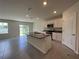 Modern kitchen featuring granite countertops, stainless steel appliances, and center island at 5350 Pine Lilly Dr, St Cloud, FL 34771