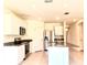 Modern kitchen featuring stainless steel appliances, white cabinets, and granite countertops at 5350 Pine Lilly Dr, St Cloud, FL 34771