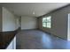 Spacious living area with tile flooring, natural light, and sliding door access to outside at 5350 Pine Lilly Dr, St Cloud, FL 34771