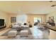 Comfortable living room with tile flooring, a dining area, and sliding glass doors to the patio at 5350 Pine Lilly Dr, St Cloud, FL 34771