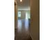 Bright, open-concept living room with tile floors and sliding glass doors leading to the outside at 5350 Pine Lilly Dr, St Cloud, FL 34771