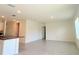Bright living room with tile floors and an open layout, seamlessly connecting to the kitchen at 5350 Pine Lilly Dr, St Cloud, FL 34771