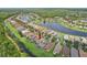 Beautiful aerial view of home, nestled amidst serene ponds and lush landscapes, perfect for relaxation and recreation at 636 Grand Canal Dr, Kissimmee, FL 34759