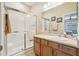 Bathroom featuring a glass-enclosed shower, a sink vanity, and coordinated fixtures at 636 Grand Canal Dr, Kissimmee, FL 34759
