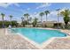 Beautiful community pool offering a refreshing escape, surrounded by palm trees and comfortable lounge seating at 636 Grand Canal Dr, Kissimmee, FL 34759