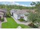 Charming single-story home featuring manicured landscaping and a welcoming walkway leading to the front entrance at 636 Grand Canal Dr, Kissimmee, FL 34759