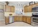 Modern kitchen equipped with stainless steel appliances, ample cabinets, and an open layout for easy entertaining at 636 Grand Canal Dr, Kissimmee, FL 34759