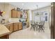Well-lit kitchen featuring stainless steel appliances, ample counter space, and a cozy dining area at 636 Grand Canal Dr, Kissimmee, FL 34759