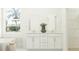 Bathroom featuring a double sink vanity, a bathtub, and a large window that offers natural light at 773 Tundra Loop, Groveland, FL 34736