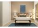 Stylish bedroom with neutral tones, modern art, and contemporary furniture with two bedside tables at 809 Tundra Loop, Groveland, FL 34736