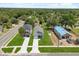 Aerial view featuring the property's location, lush landscaping, and modern design at 811 E Mcdonald Ave, Eustis, FL 32726