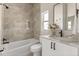 Bathroom features a shower, bathtub, a window, and modern fixtures at 811 E Mcdonald Ave, Eustis, FL 32726