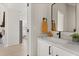 Modern bathroom featuring a vanity with quartz countertop, sleek black hardware, and modern black framed mirror at 811 E Mcdonald Ave, Eustis, FL 32726