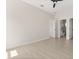 Bright bedroom featuring sleek ceiling fan, hardwood floors, and attached bathroom with a modern design at 811 E Mcdonald Ave, Eustis, FL 32726