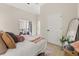 Relaxing bedroom with balcony access and a stylish full-length mirror at 811 E Mcdonald Ave, Eustis, FL 32726