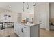 Kitchen island with drawers and cabinets, and a view of the dining area at 811 E Mcdonald Ave, Eustis, FL 32726