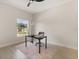Well-lit office with a ceiling fan, a desk by the window, and wood floors for a productive atmosphere at 811 E Mcdonald Ave, Eustis, FL 32726