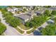 Aerial view of home in a neighborhood, featuring mature trees, sidewalks, and well-maintained lawns at 8256 Bayview Crossing Dr, Winter Garden, FL 34787