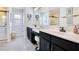 Elegant bathroom with double vanity, white countertops, and modern fixtures at 8256 Bayview Crossing Dr, Winter Garden, FL 34787