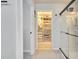 Bathroom view through doorway, featuring walk in closet, glass shower, and tile floors at 8256 Bayview Crossing Dr, Winter Garden, FL 34787