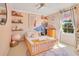 Cozy bedroom featuring a wooden bed frame, soft rug, and charming decor elements at 8256 Bayview Crossing Dr, Winter Garden, FL 34787
