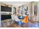 Elegant dining area with contemporary lighting, complemented by modern decor and hardwood flooring at 8256 Bayview Crossing Dr, Winter Garden, FL 34787