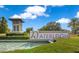 Waterleigh entrance sign with serene water feature, lush landscaping, and clear blue sky at 8256 Bayview Crossing Dr, Winter Garden, FL 34787